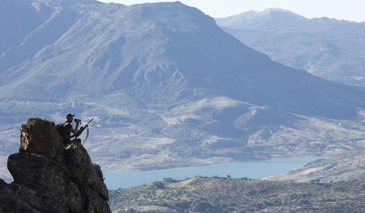 Jens Kjaer Knudsen hunter spotting from a rock when hunting the Southeastern Ibex, hunting in Spain