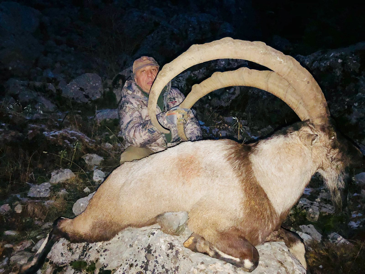 Hunter with a big bezoar ibex trophy, hunting in Turkey