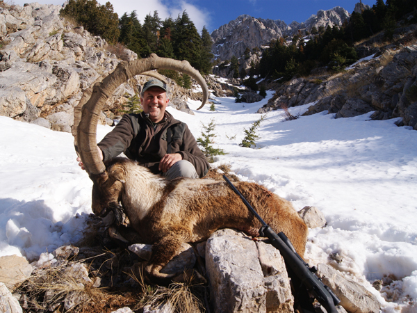 Hunter with a huge bezoar ibex trophy, hunting in Turkey