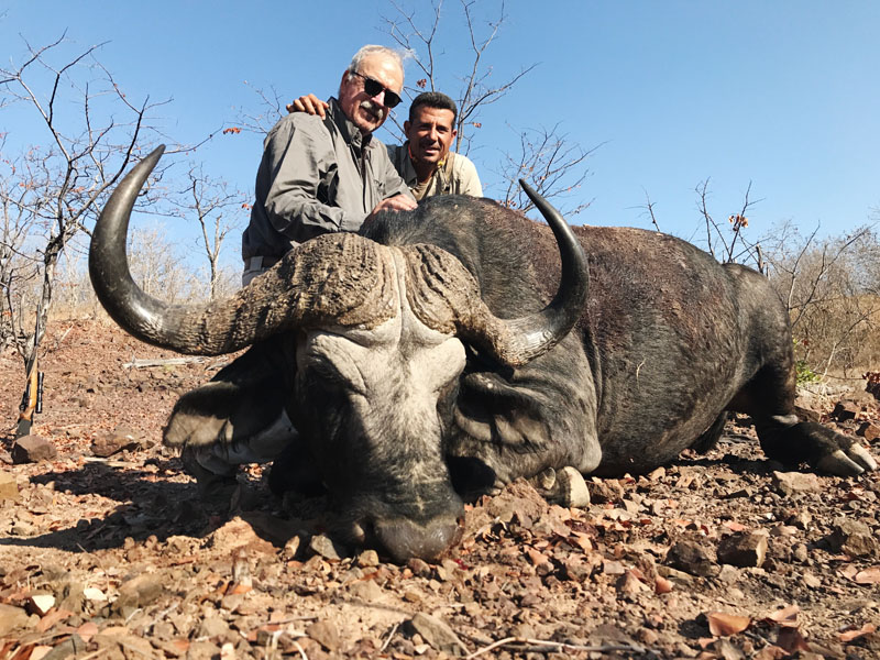 Hunter with a buffalo trophy, hunting in Zimbabwe