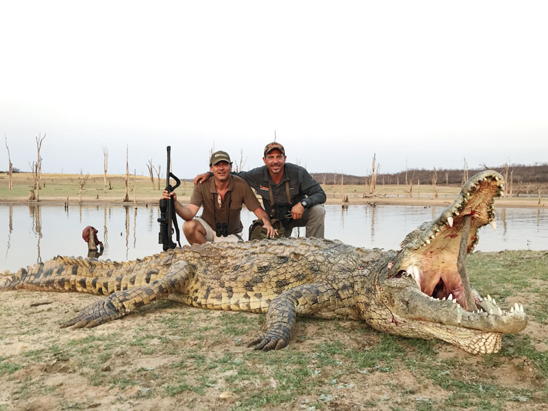 Hunter with a crocodile trophy, hunting in Zimbabwe
