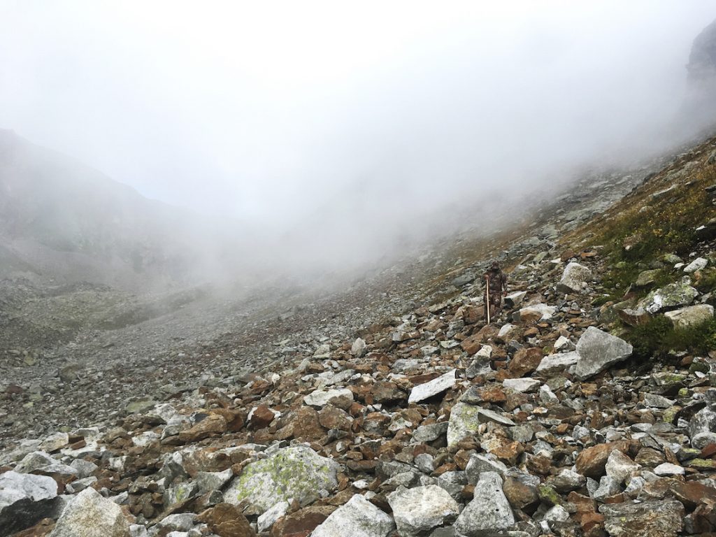Climbing the mountain down while hunting the Kuban Tur in the Caucasus, Russia